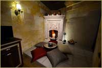 Superior Deluxe Stone Room Kuzey Honeymoon Room fireplace in Cave Hotel Cappadocia