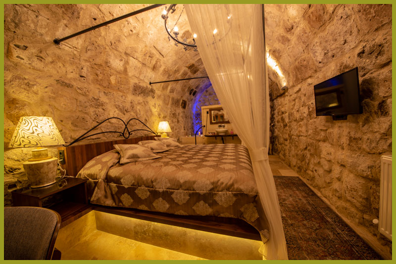 Premium Deluxe Mağara Oda  olden Apple Kapadokya Mağara Otel Balayı Odası Yatak